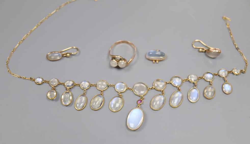 A yellow metal and moonstone set drop necklace, a 9ct gold two stone moonstone crossover ring and pair of drop earrings